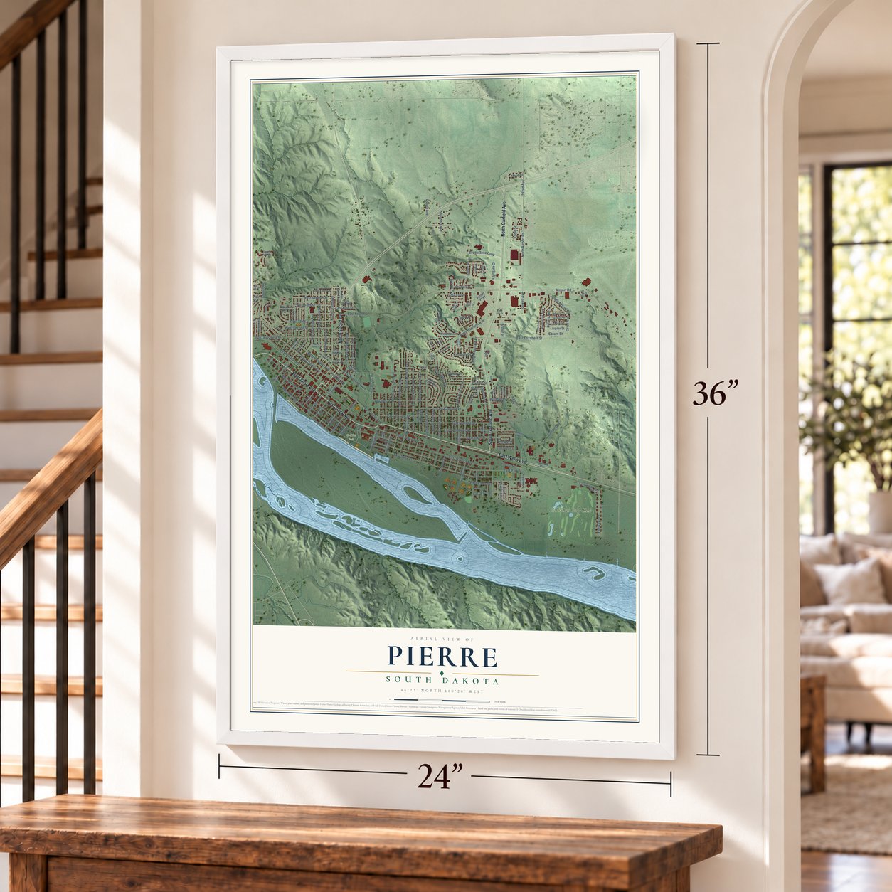 Pierre, South Dakota map, 24 x 36 inch print in a white frame by a staircase