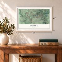 Pikesville, Maryland map, 12 x 18 inch print in a white frame in an entryway