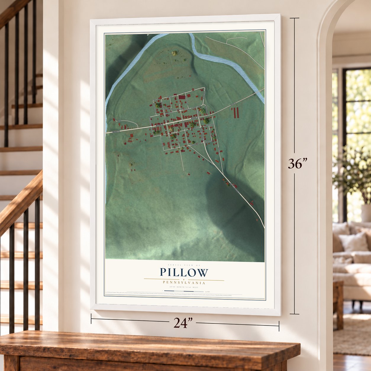 Pillow, Pennsylvania map, 24 x 36 inch print in a white frame by a staircase