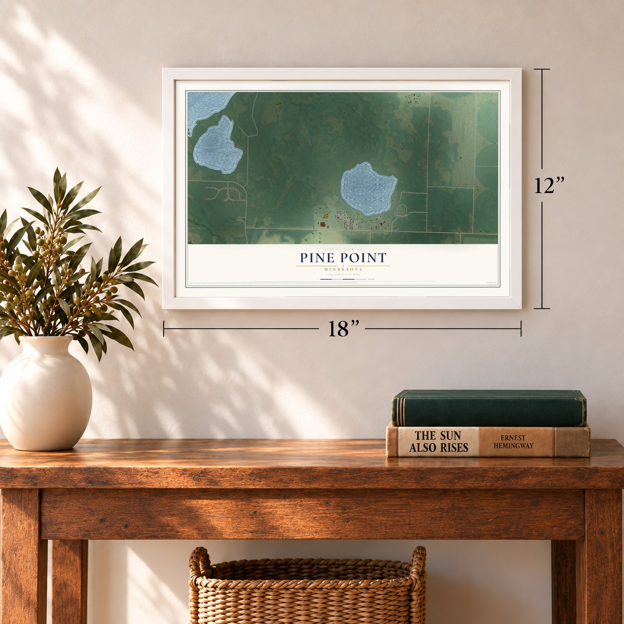 Pine Point, Minnesota map, 12 x 18 inch print in a white frame in an entryway
