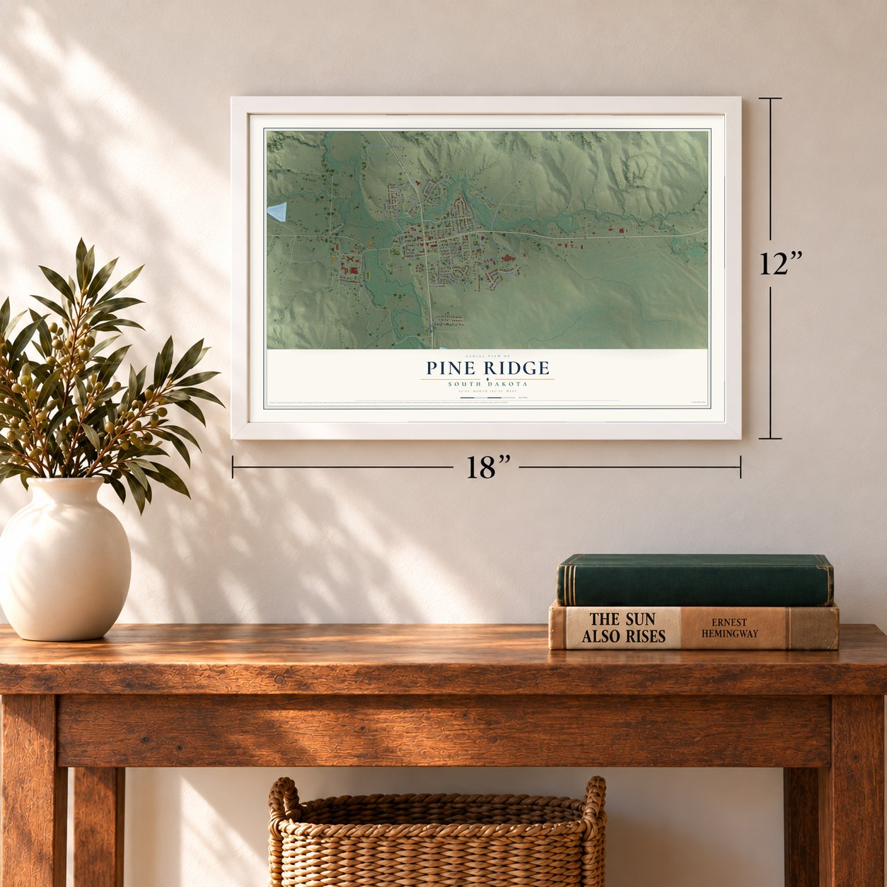 Pine Ridge, South Dakota map, 12 x 18 inch print in a white frame in an entryway