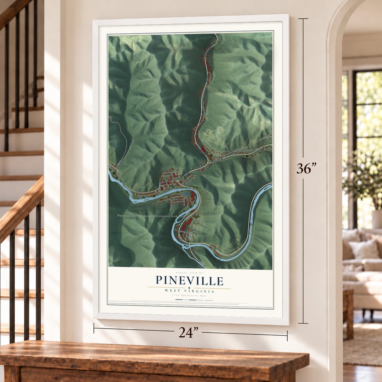 Pineville, West Virginia map, 24 x 36 inch print in a white frame by a staircase