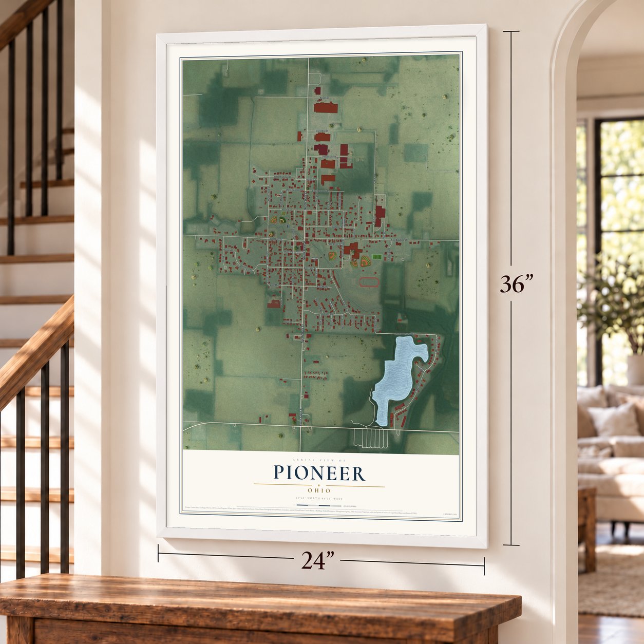 Pioneer, Ohio map, 24 x 36 inch print in a white frame by a staircase
