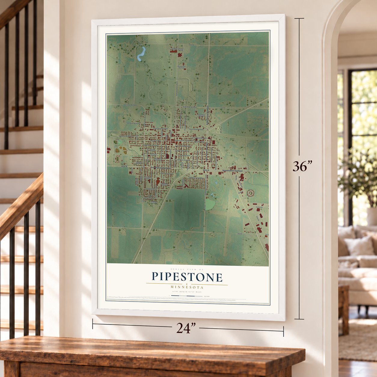 Pipestone, Minnesota map, 24 x 36 inch print in a white frame by a staircase