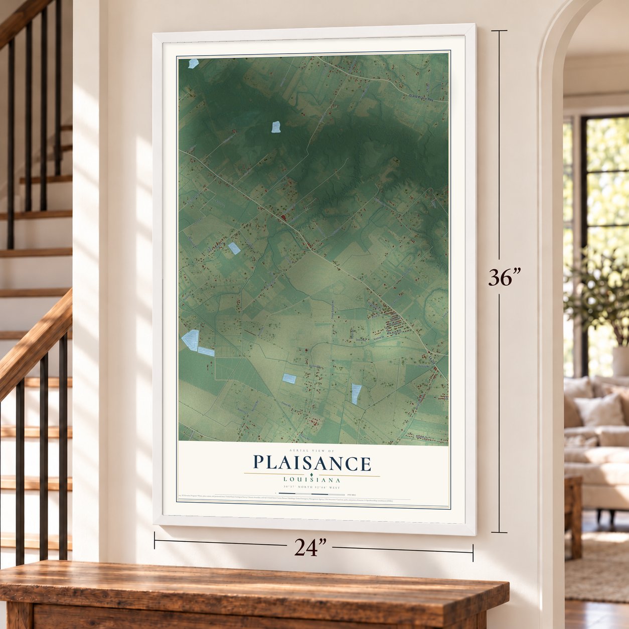 Plaisance, Louisiana map, 24 x 36 inch print in a white frame by a staircase