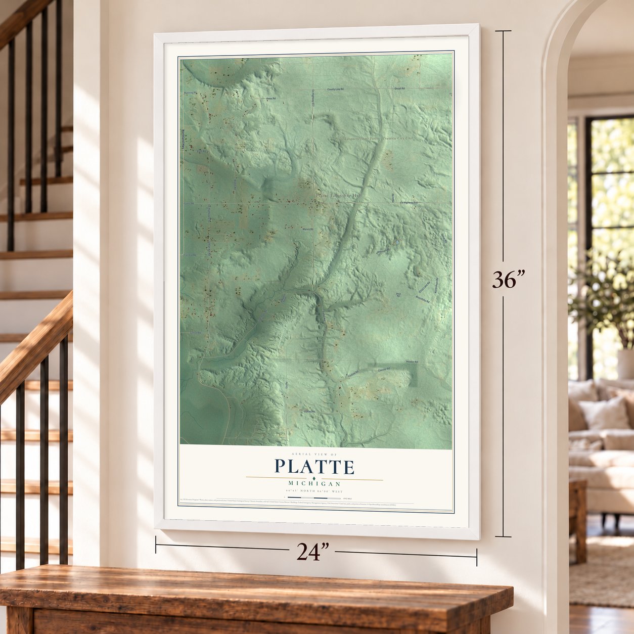 Platte, Michigan map, 24 x 36 inch print in a white frame by a staircase