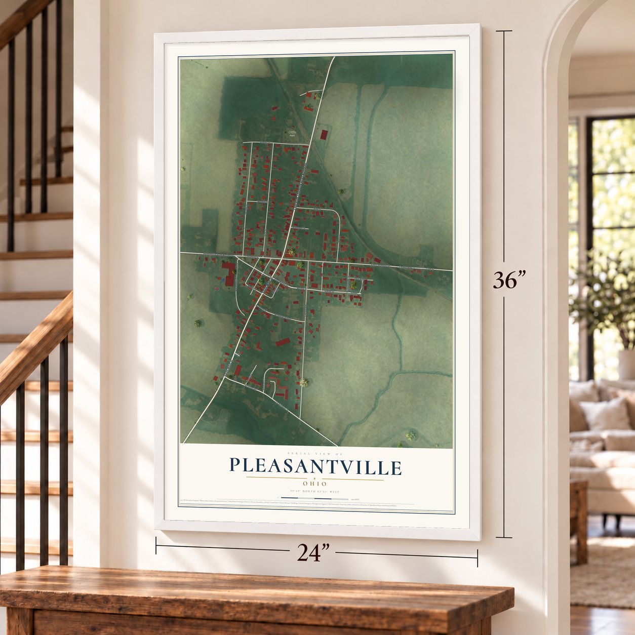 Pleasantville, Ohio map, 24 x 36 inch print in a white frame by a staircase