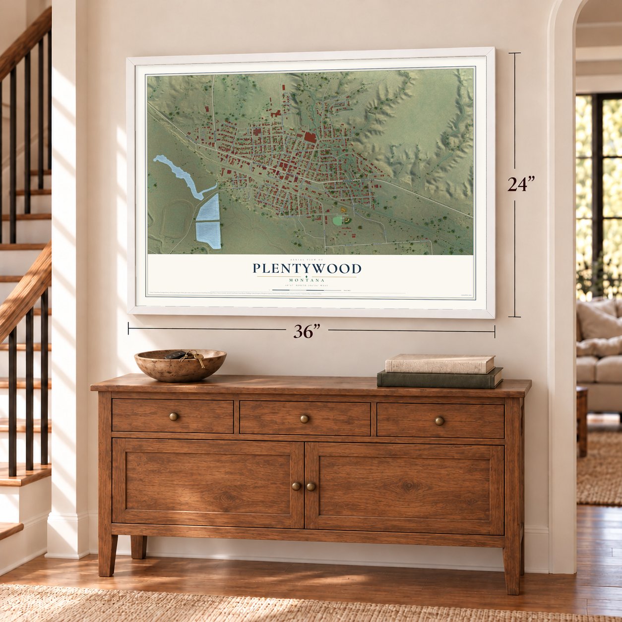 Plentywood, Montana map, 24 x 36 inch print in a white frame above a dresser by a staircase