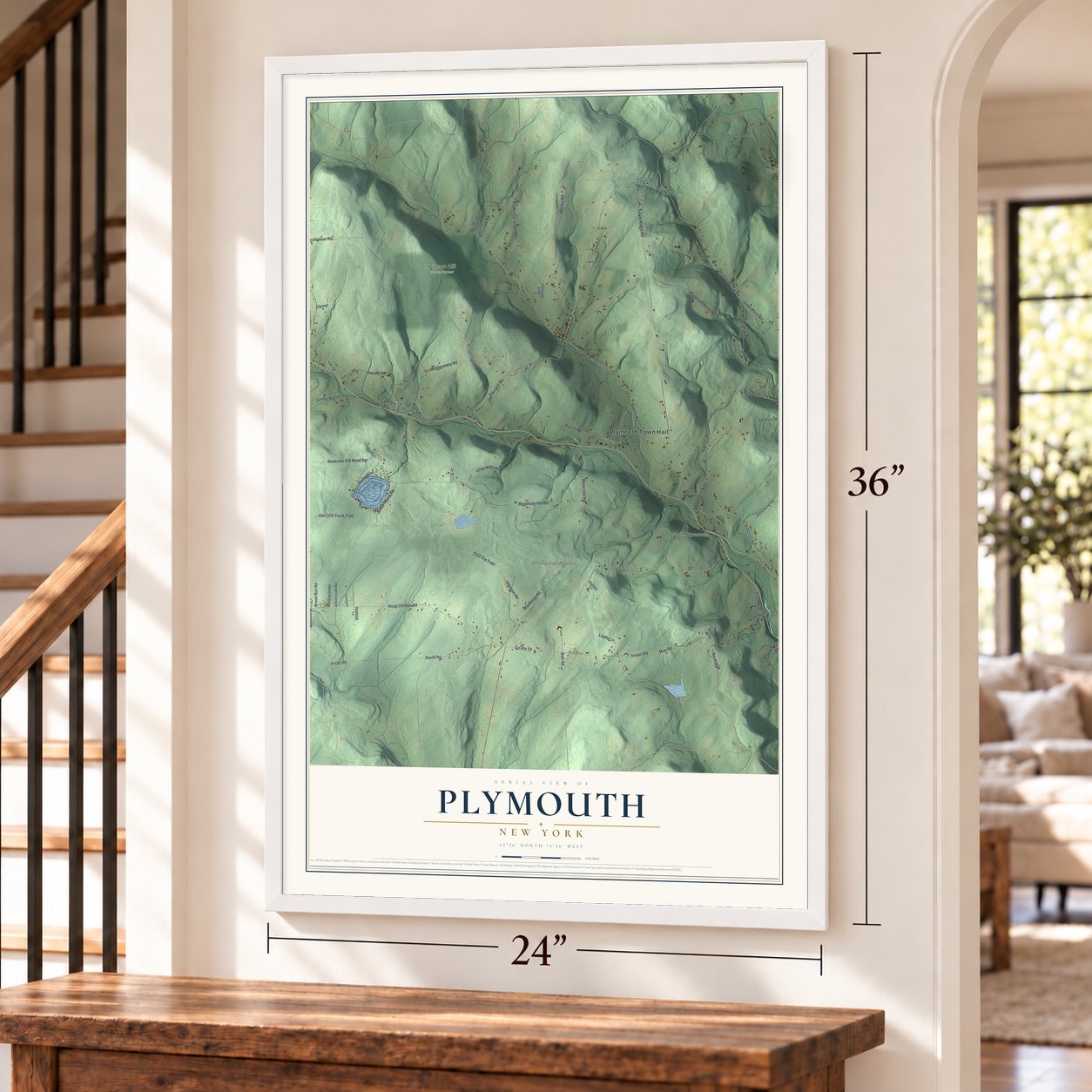 Plymouth, New York map, 24 x 36 inch print in a white frame by a staircase