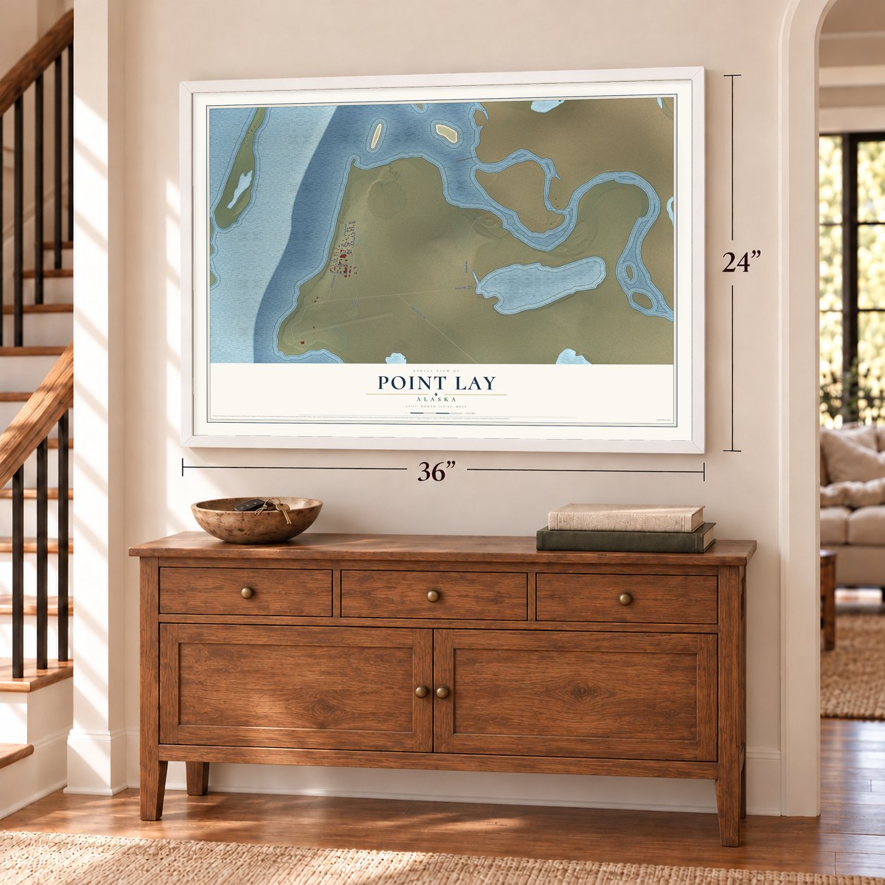 Point Lay, Alaska map, 24 x 36 inch print in a white frame above a dresser by a staircase