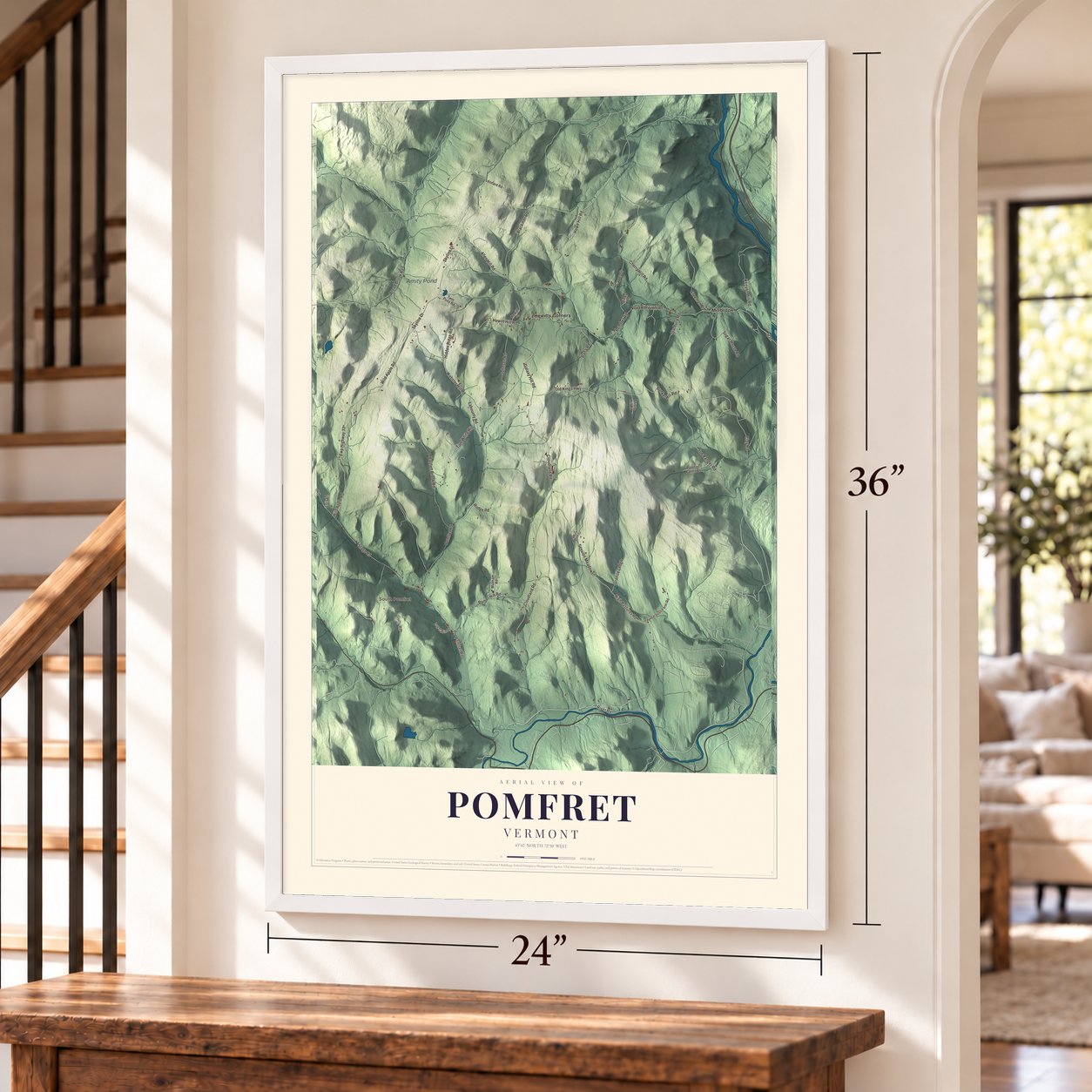 Pomfret, Vermont map, 24 x 36 inch print in a white frame by a staircase
