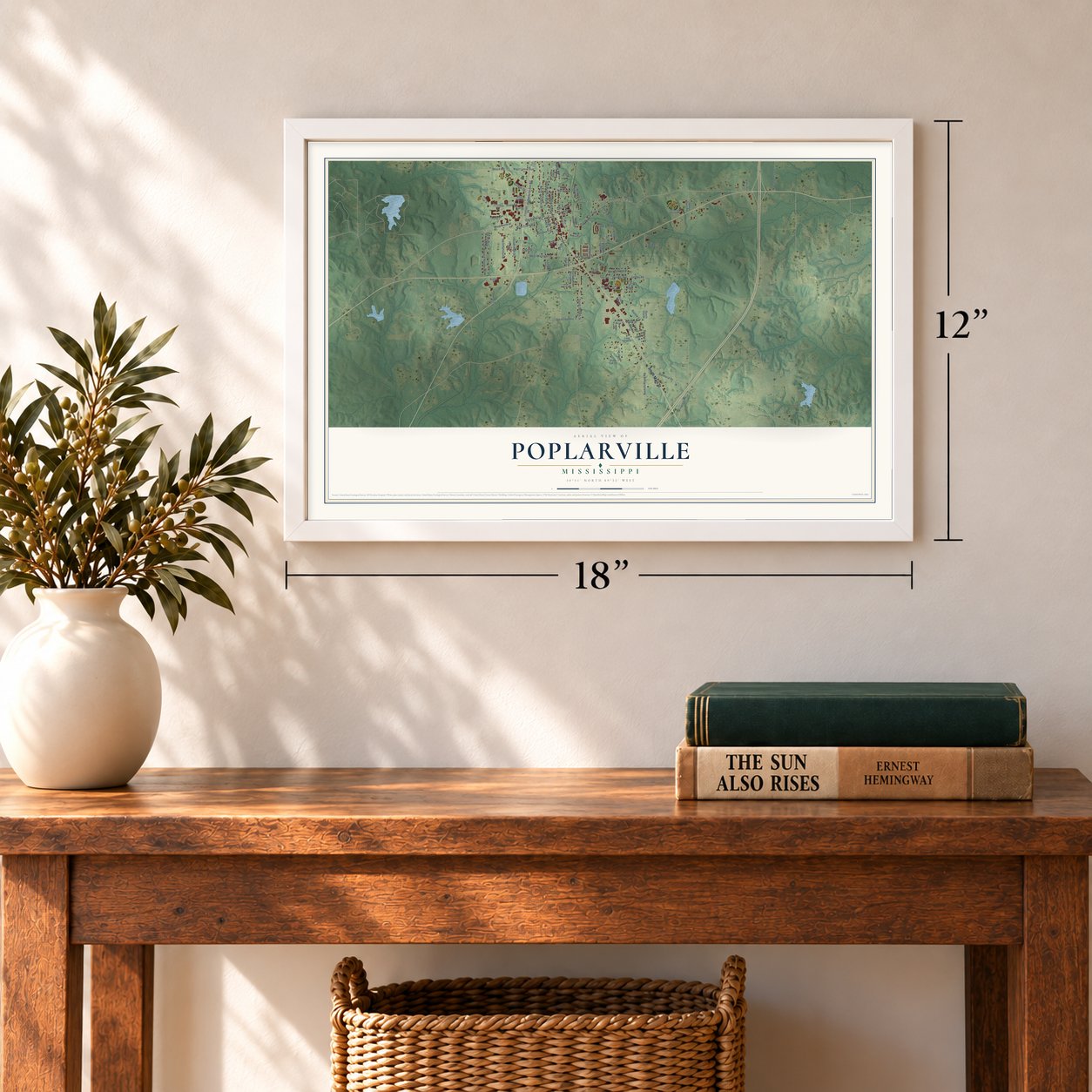 Poplarville, Mississippi map, 12 x 18 inch print in a white frame in an entryway
