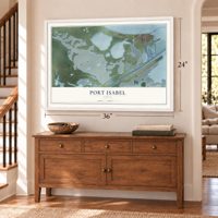 Port Isabel, Texas map, 24 x 36 inch print in a white frame above a dresser by a staircase
