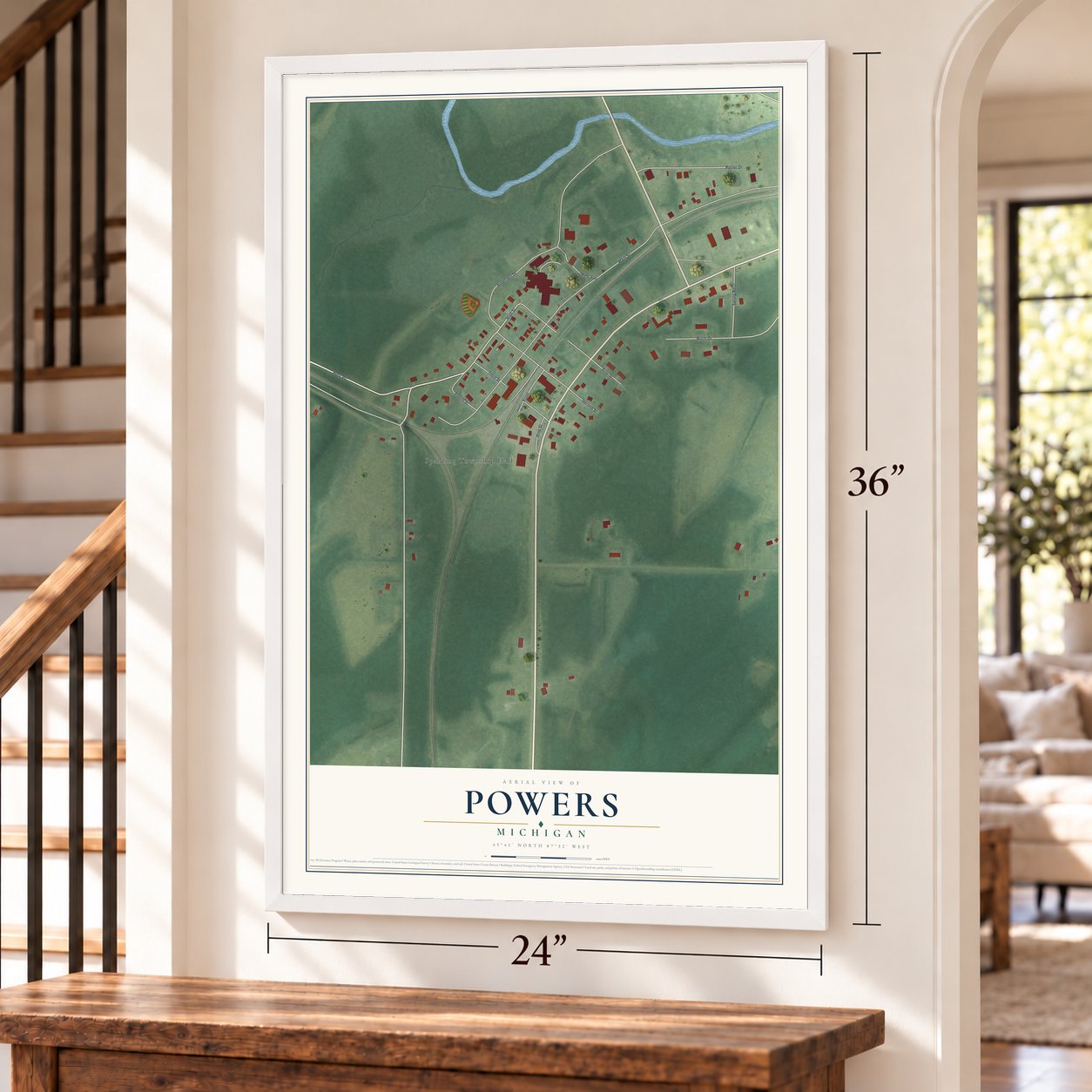 Powers, Michigan map, 24 x 36 inch print in a white frame by a staircase