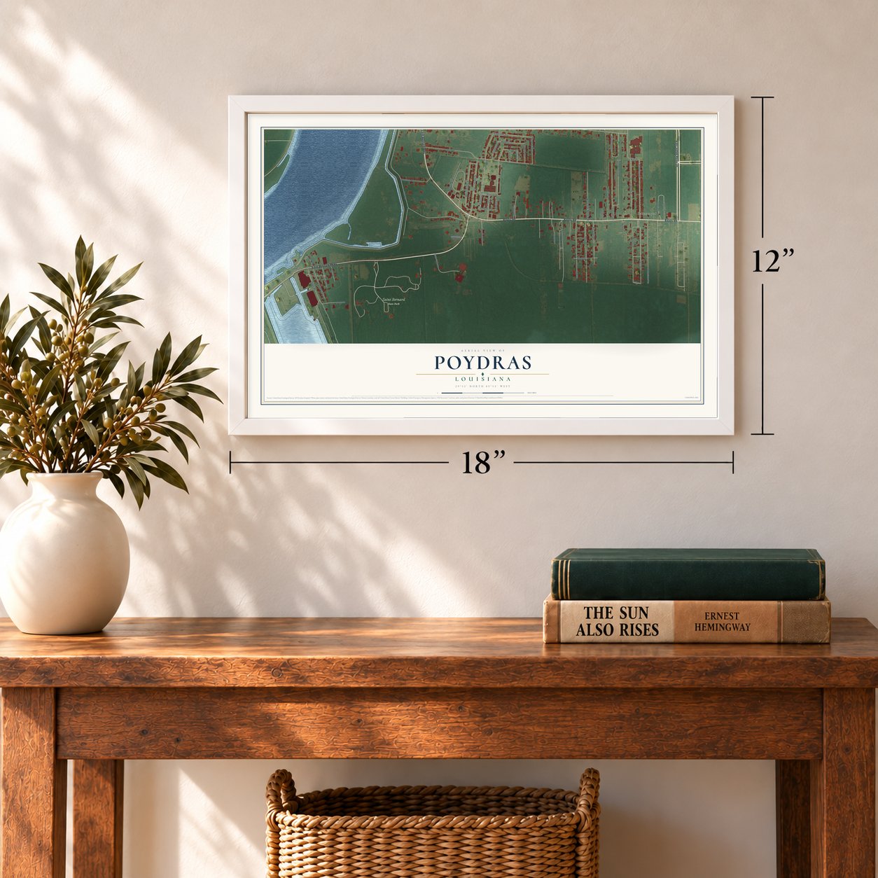 Poydras, Louisiana map, 12 x 18 inch print in a white frame in an entryway