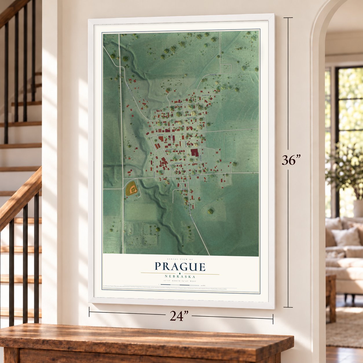 Prague, Nebraska map, 24 x 36 inch print in a white frame by a staircase