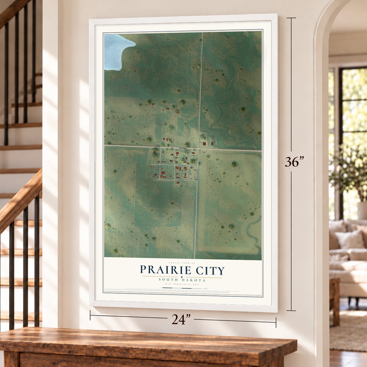 Prairie City, South Dakota map, 24 x 36 inch print in a white frame by a staircase