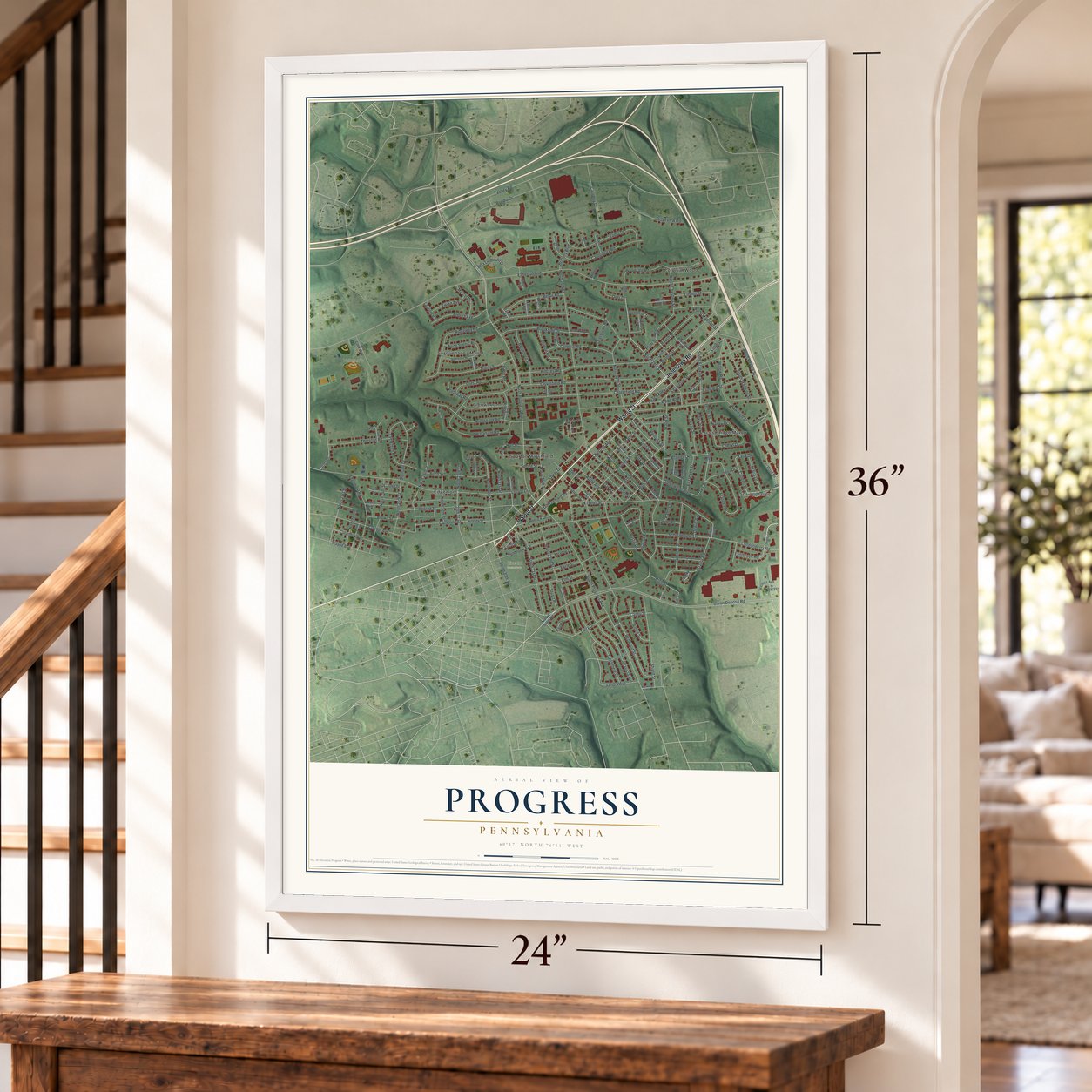 Progress, Pennsylvania map, 24 x 36 inch print in a white frame by a staircase