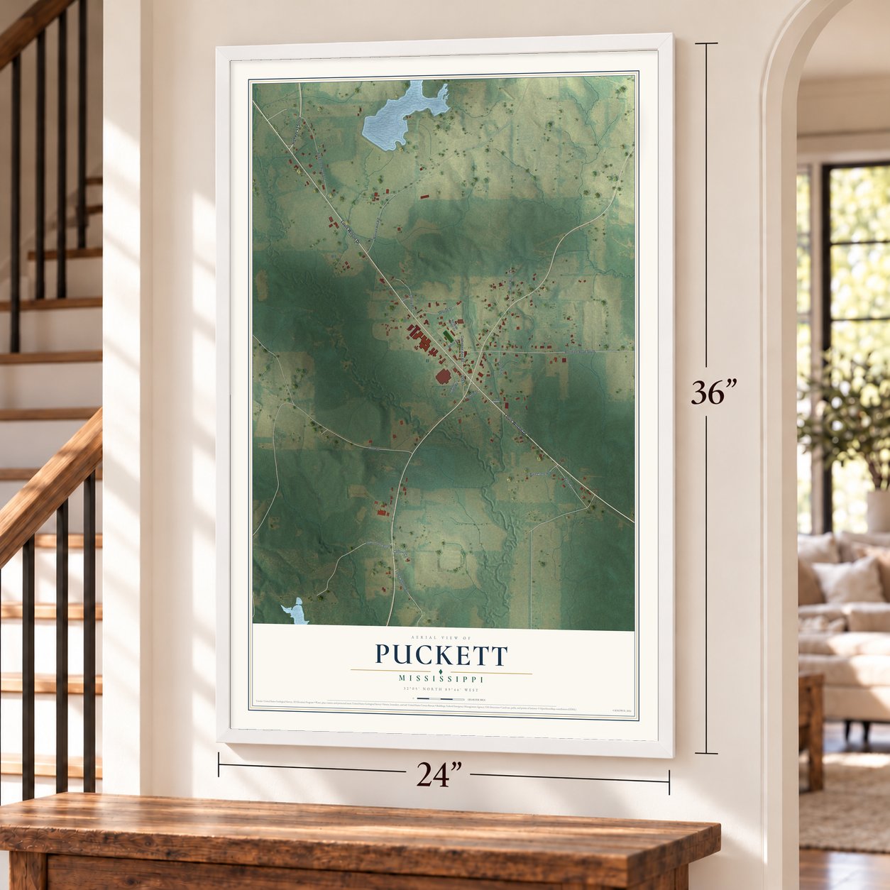 Puckett, Mississippi map, 24 x 36 inch print in a white frame by a staircase