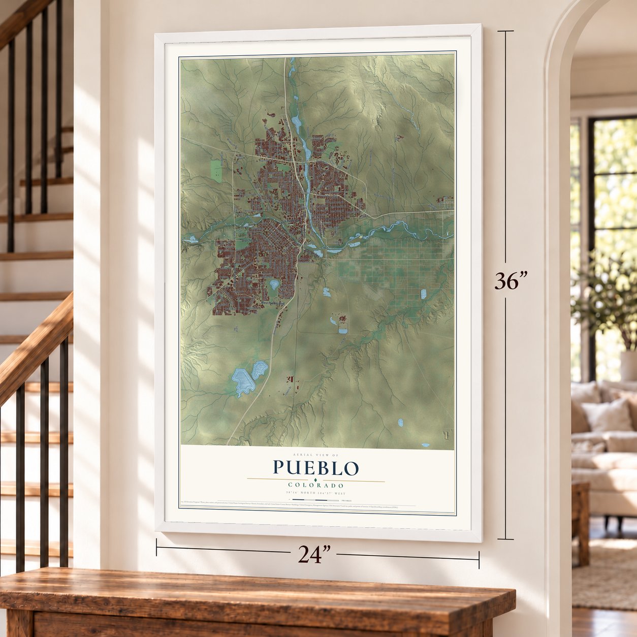 Pueblo, Colorado map, 24 x 36 inch print in a white frame by a staircase