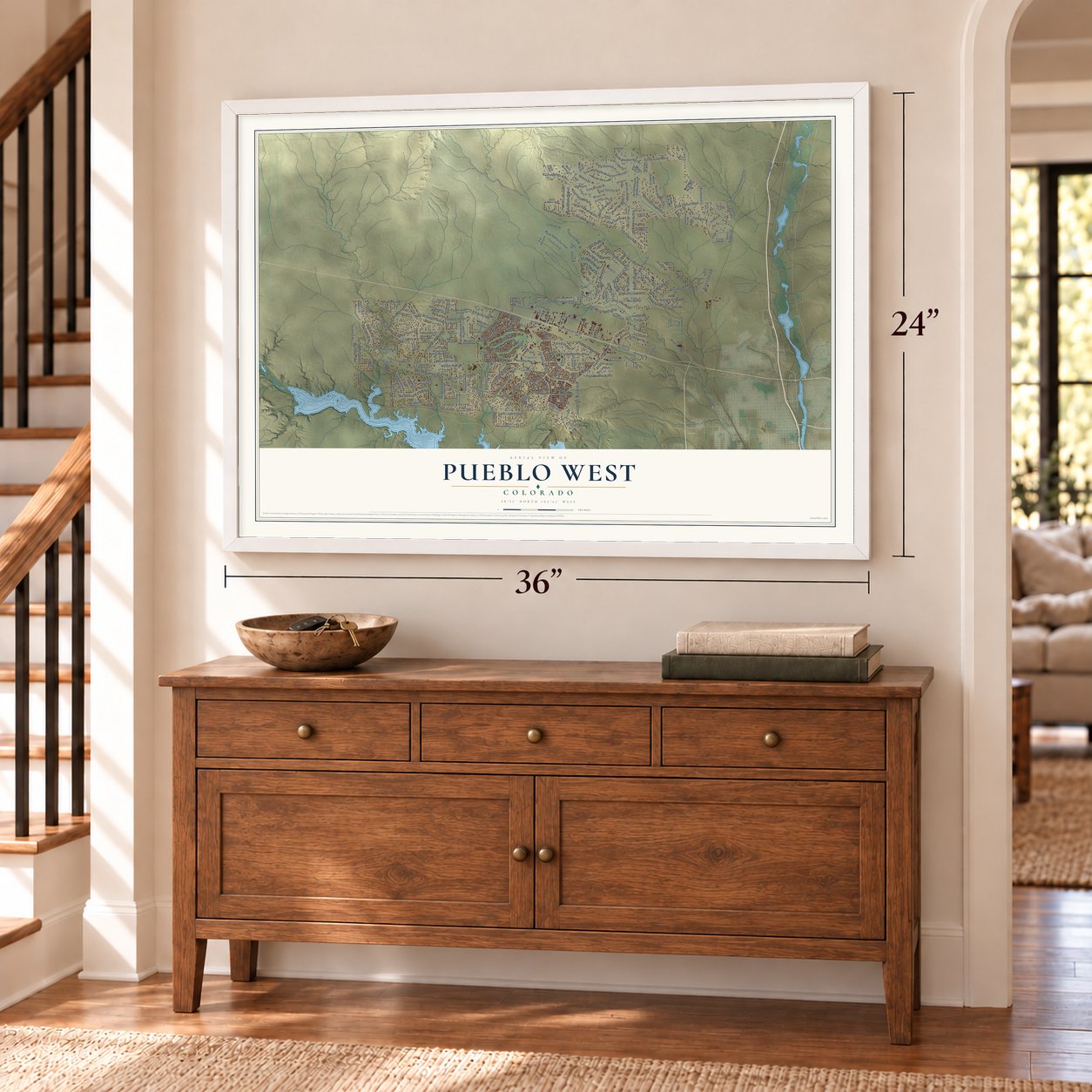 Pueblo West, Colorado map, 24 x 36 inch print in a white frame above a dresser by a staircase