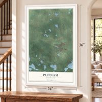 Putnam, Michigan map, 24 x 36 inch print in a white frame by a staircase
