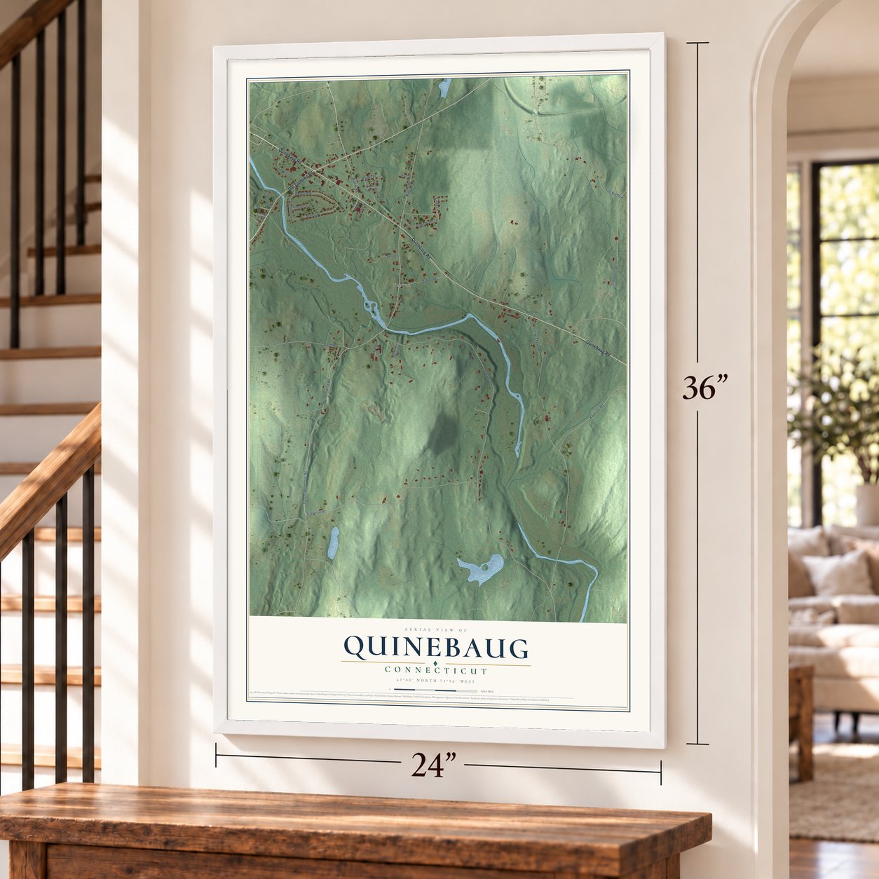 Quinebaug, Connecticut map, 24 x 36 inch print in a white frame by a staircase