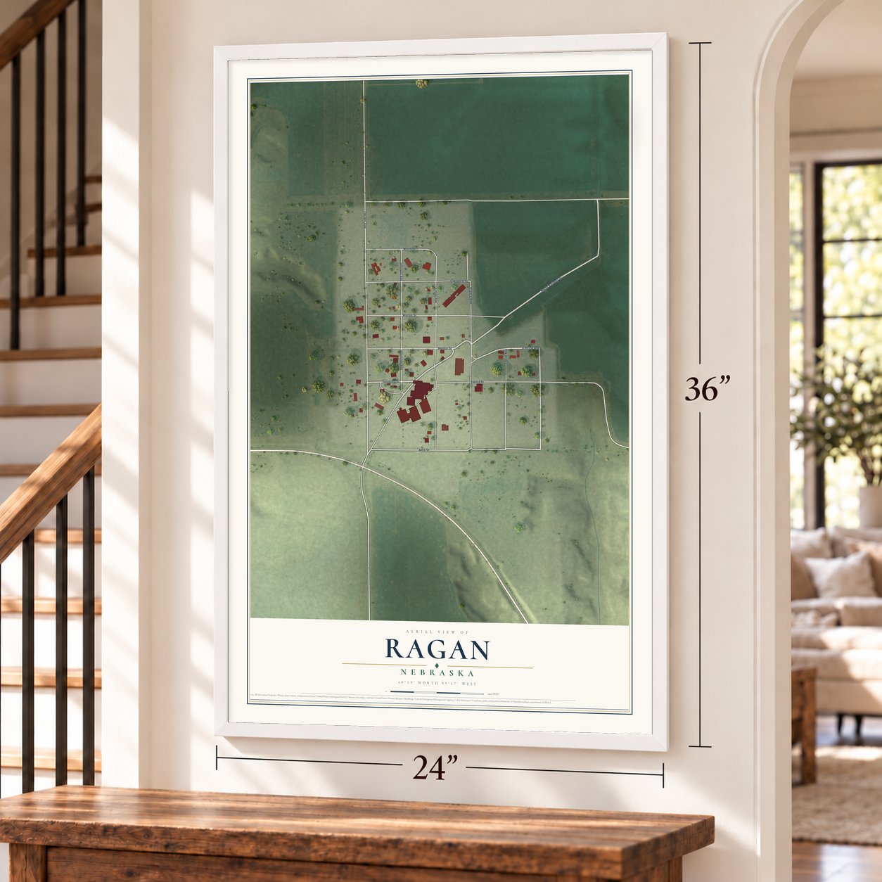 Ragan, Nebraska map, 24 x 36 inch print in a white frame by a staircase