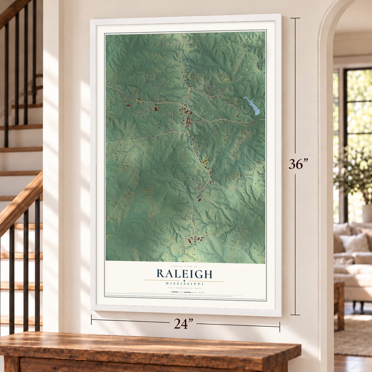 Raleigh, Mississippi map, 24 x 36 inch print in a white frame by a staircase