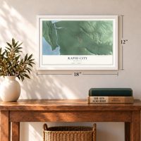 Rapid City, Michigan map, 12 x 18 inch print in a white frame in an entryway