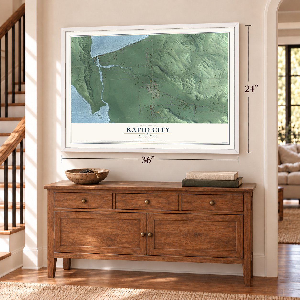 Rapid City, Michigan map, 24 x 36 inch print in a white frame above a dresser by a staircase