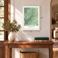 Rapid River, Michigan map, 12 x 18 inch print in a white frame in an entryway