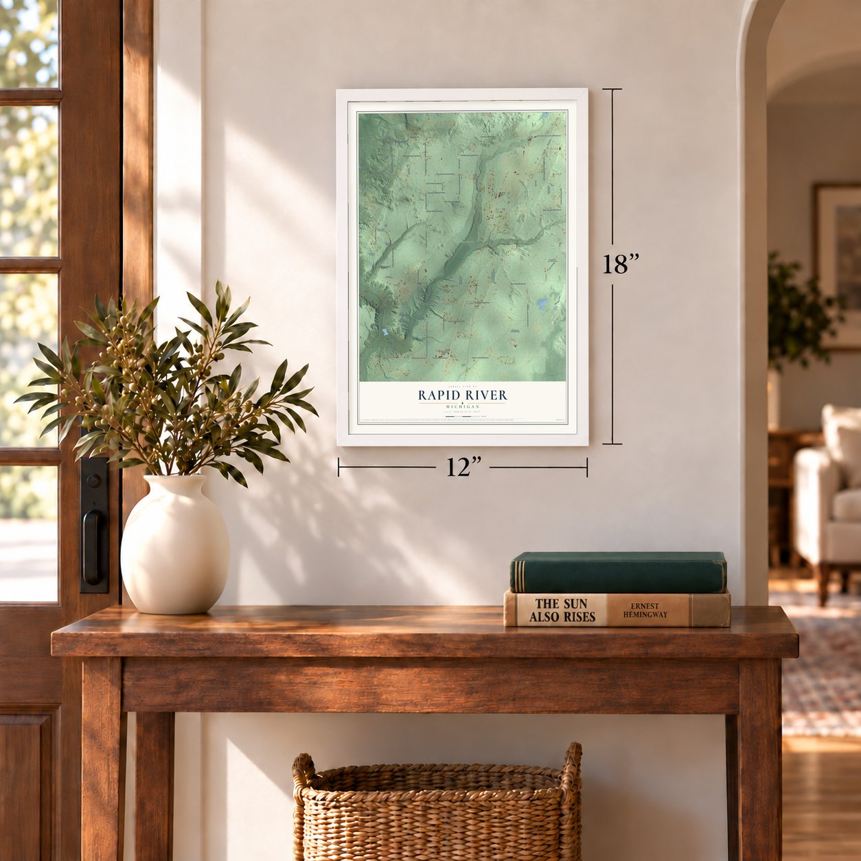 Rapid River, Michigan map, 12 x 18 inch print in a white frame in an entryway