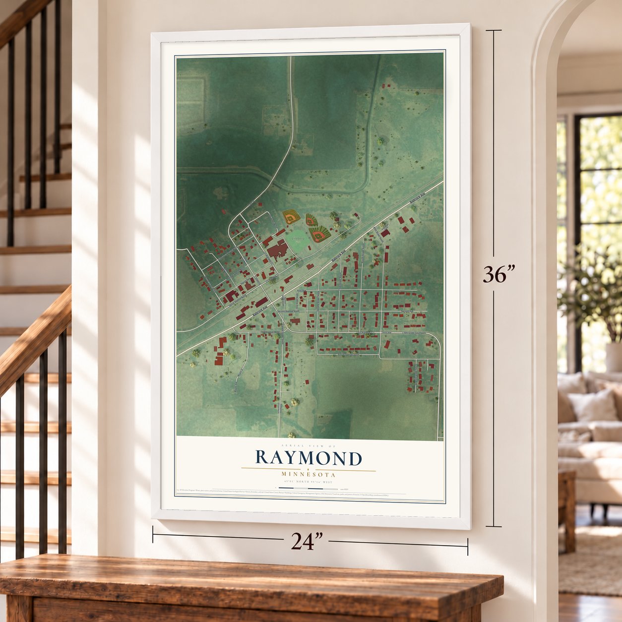 Raymond, Minnesota map, 24 x 36 inch print in a white frame by a staircase