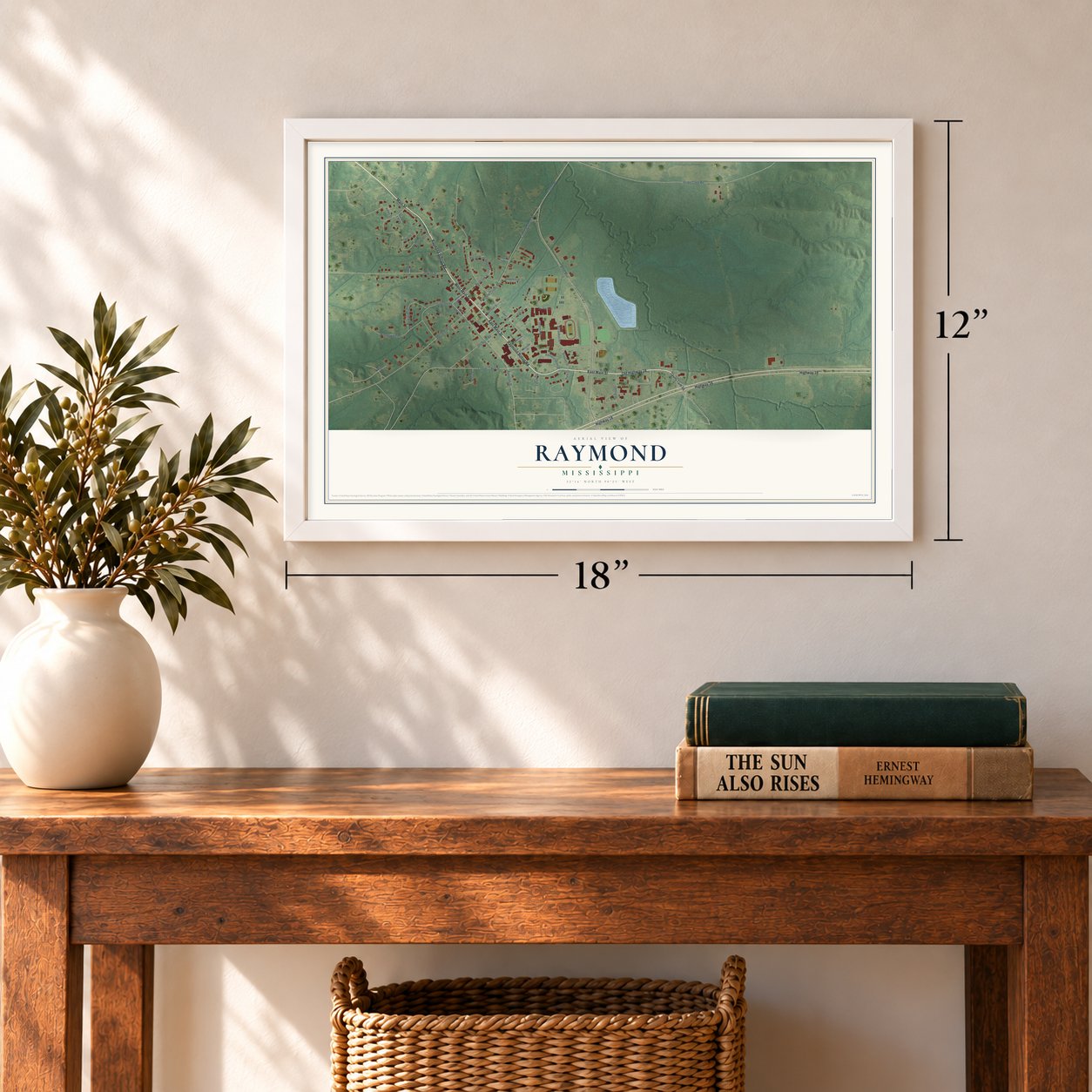 Raymond, Mississippi map, 12 x 18 inch print in a white frame in an entryway