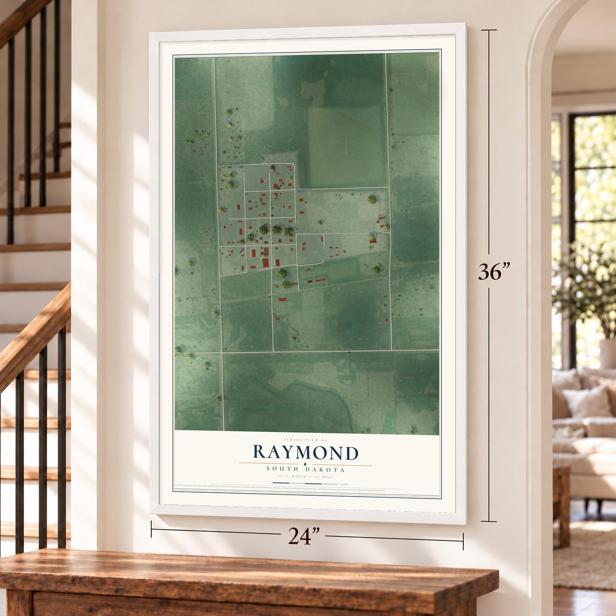 Raymond, South Dakota map, 24 x 36 inch print in a white frame by a staircase