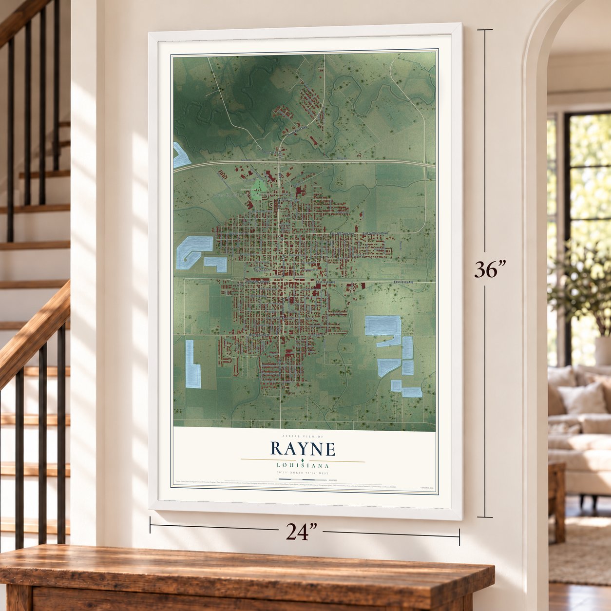 Rayne, Louisiana map, 24 x 36 inch print in a white frame by a staircase