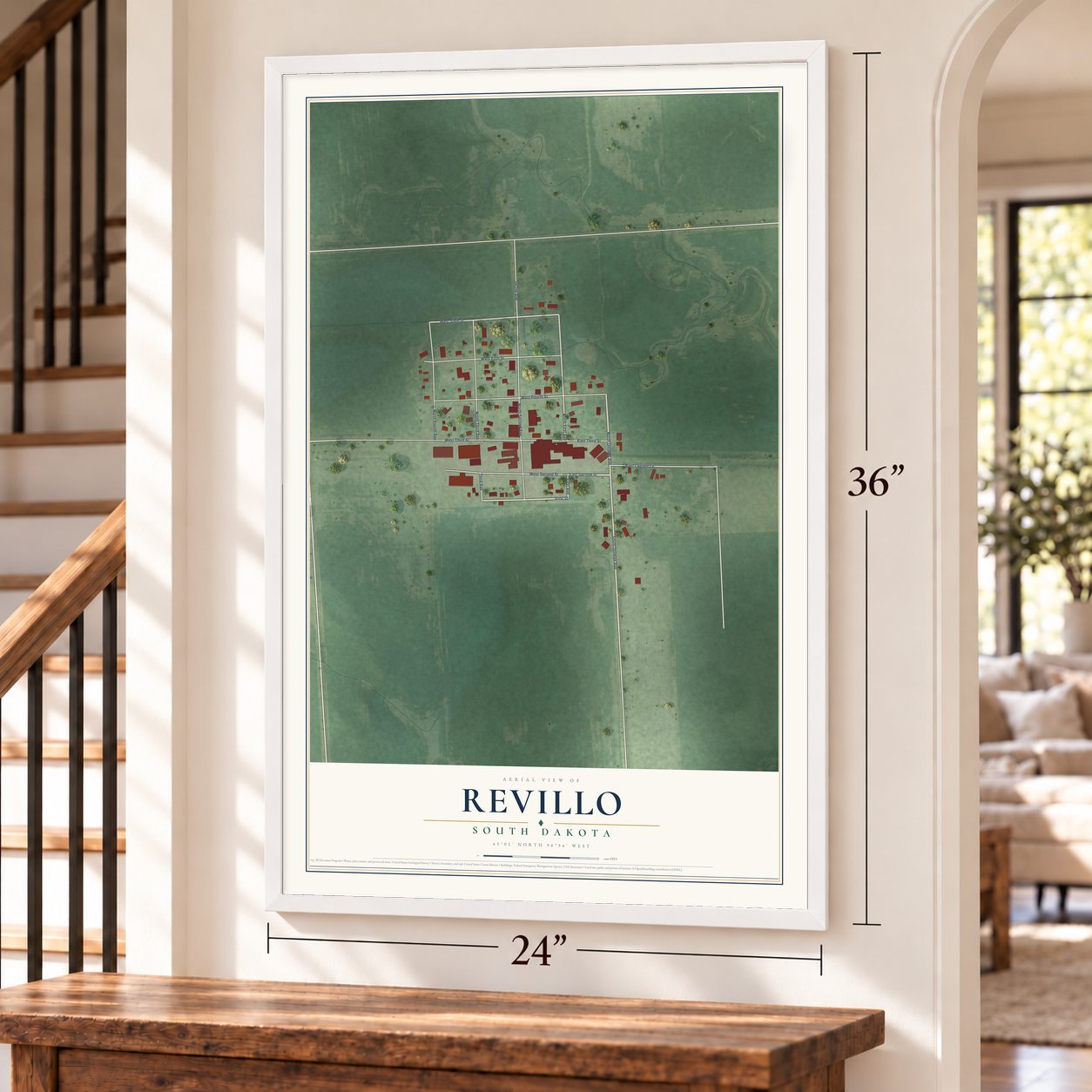 Revillo, South Dakota map, 24 x 36 inch print in a white frame by a staircase