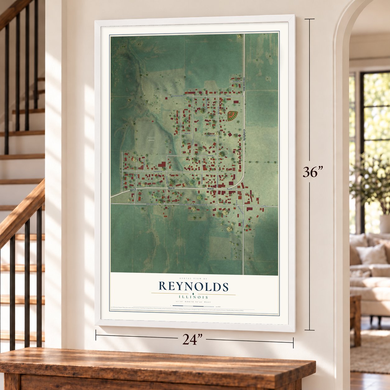 Reynolds, Illinois map, 24 x 36 inch print in a white frame by a staircase