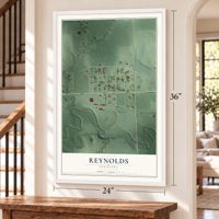 Reynolds, Nebraska map, 24 x 36 inch print in a white frame by a staircase