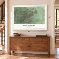 Reynoldsburg, Ohio map, 24 x 36 inch print in a white frame above a dresser by a staircase