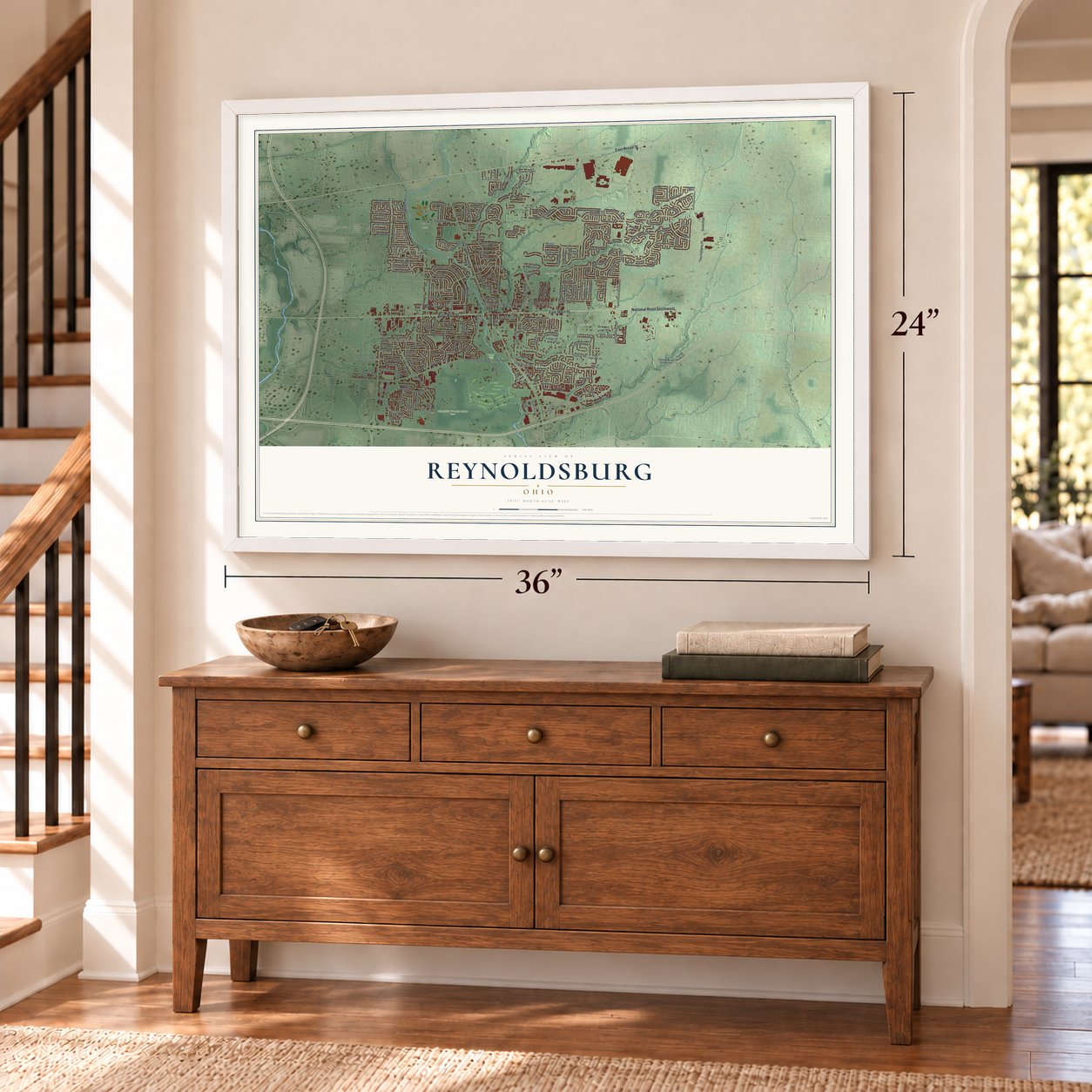 Reynoldsburg, Ohio map, 24 x 36 inch print in a white frame above a dresser by a staircase