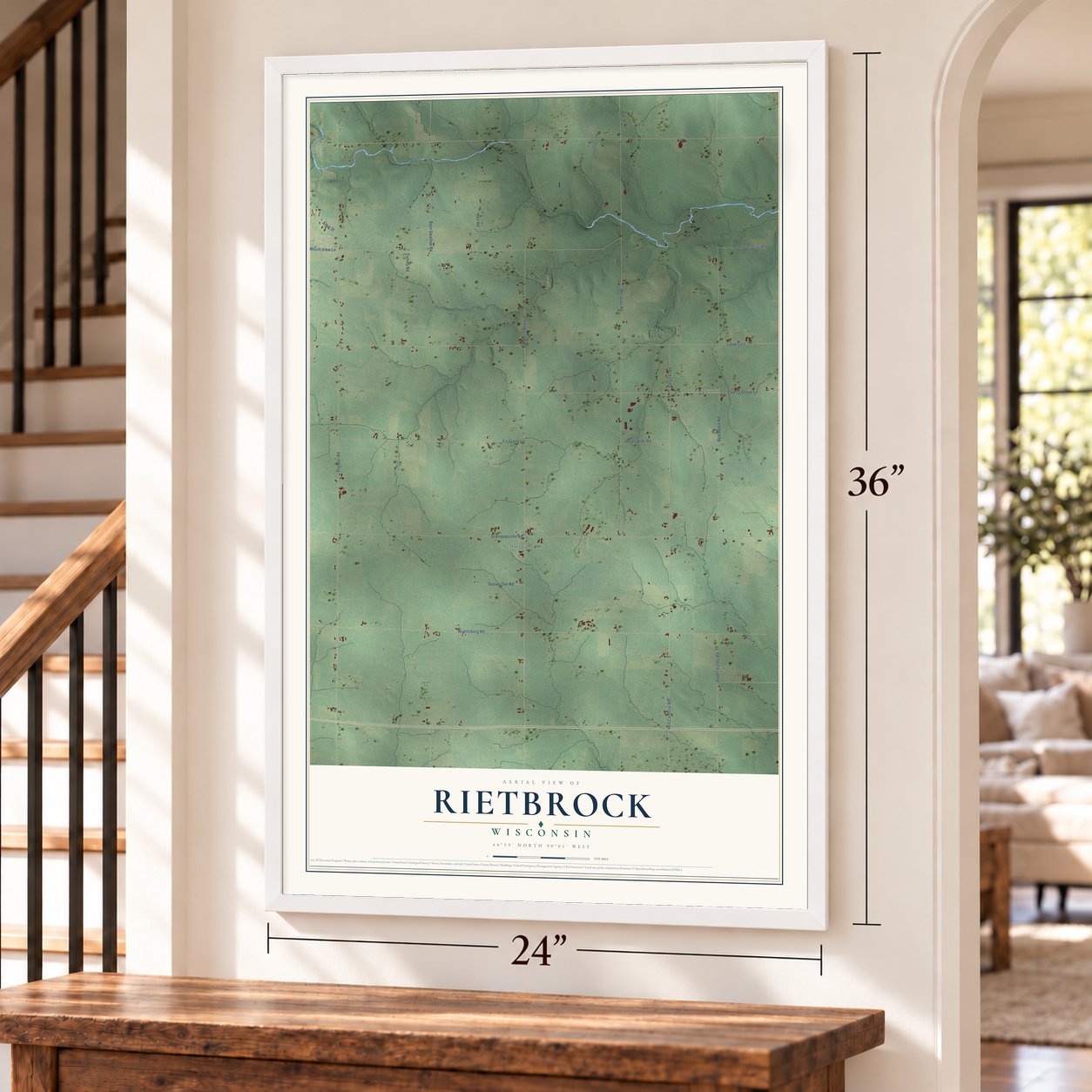 Rietbrock, Wisconsin map, 24 x 36 inch print in a white frame by a staircase