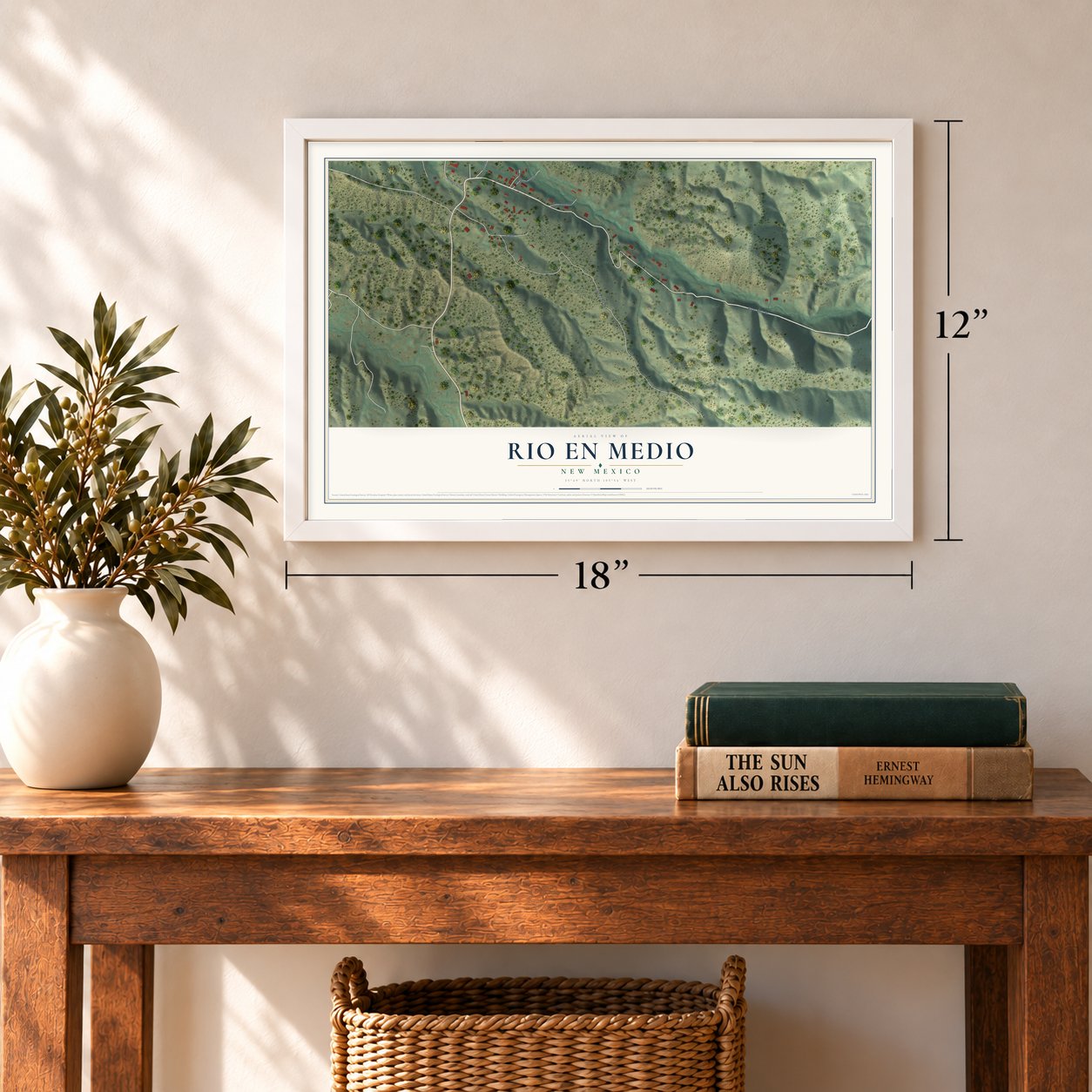 Rio en Medio, New Mexico map, 12 x 18 inch print in a white frame in an entryway