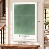 Robertson, Wyoming map, 24 x 36 inch print in a white frame by a staircase