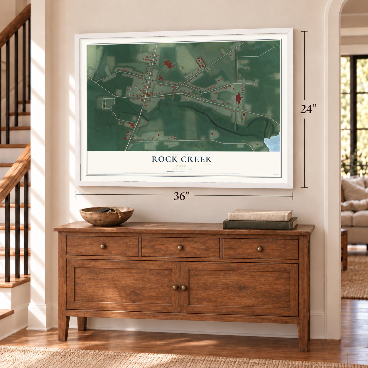 Rock Creek, Ohio map, 24 x 36 inch print in a white frame above a dresser by a staircase