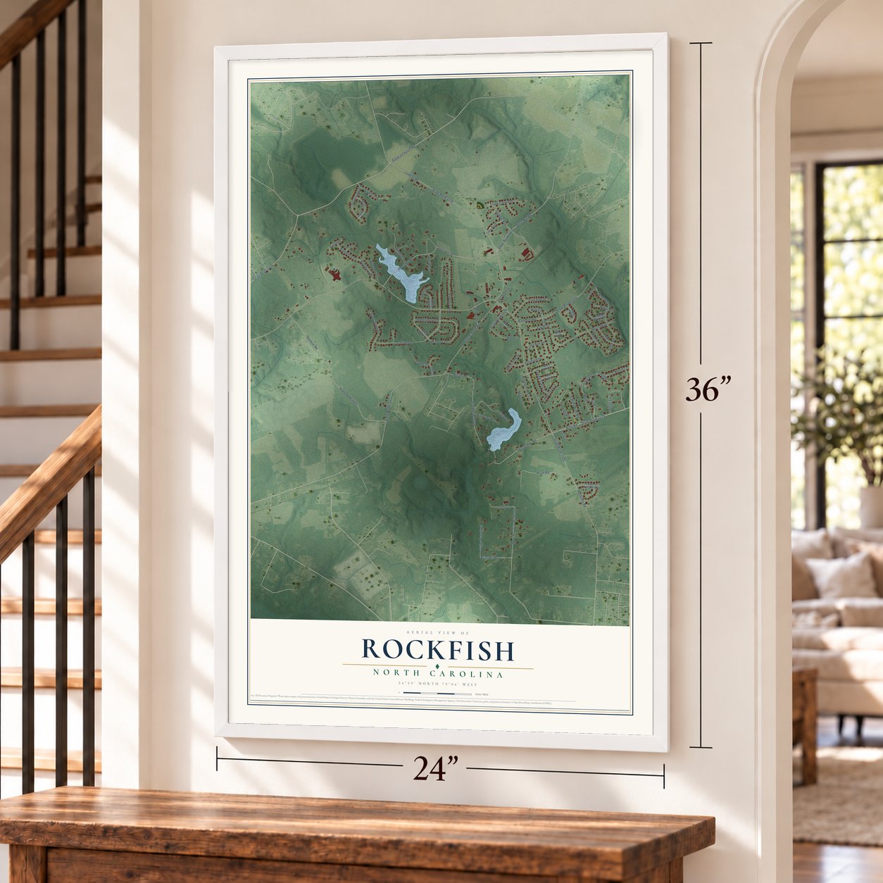 Rockfish, North Carolina map, 24 x 36 inch print in a white frame by a staircase