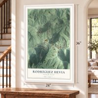 Rodríguez Hevia, Puerto Rico map, 24 x 36 inch print in a white frame by a staircase