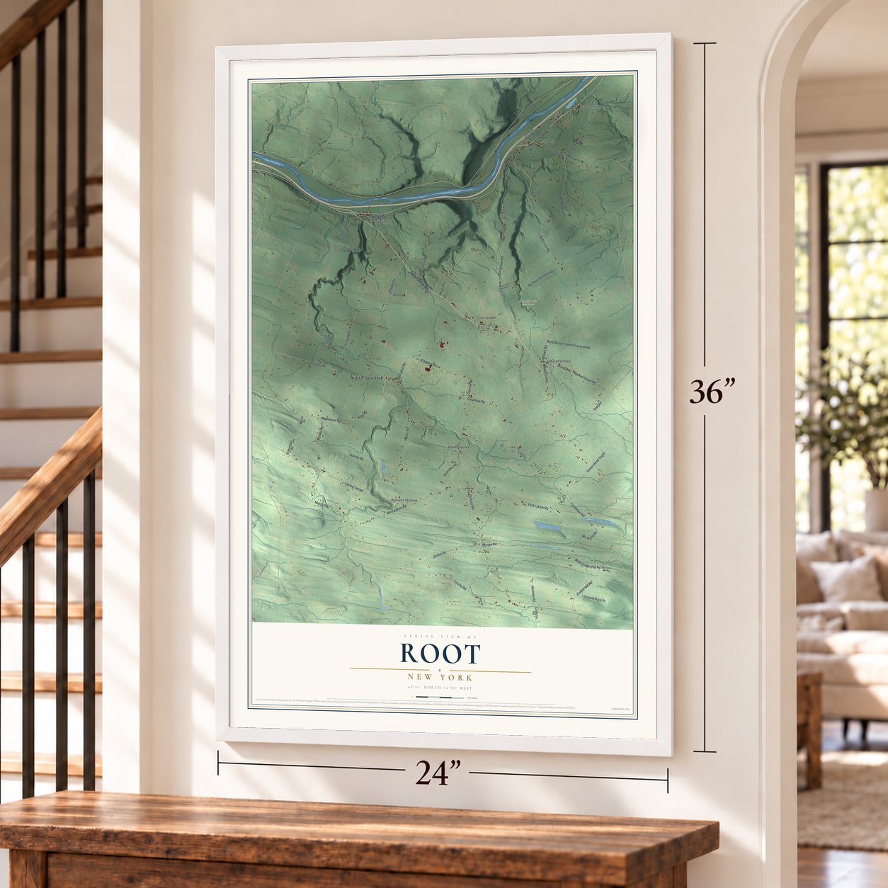 Root, New York map, 24 x 36 inch print in a white frame by a staircase
