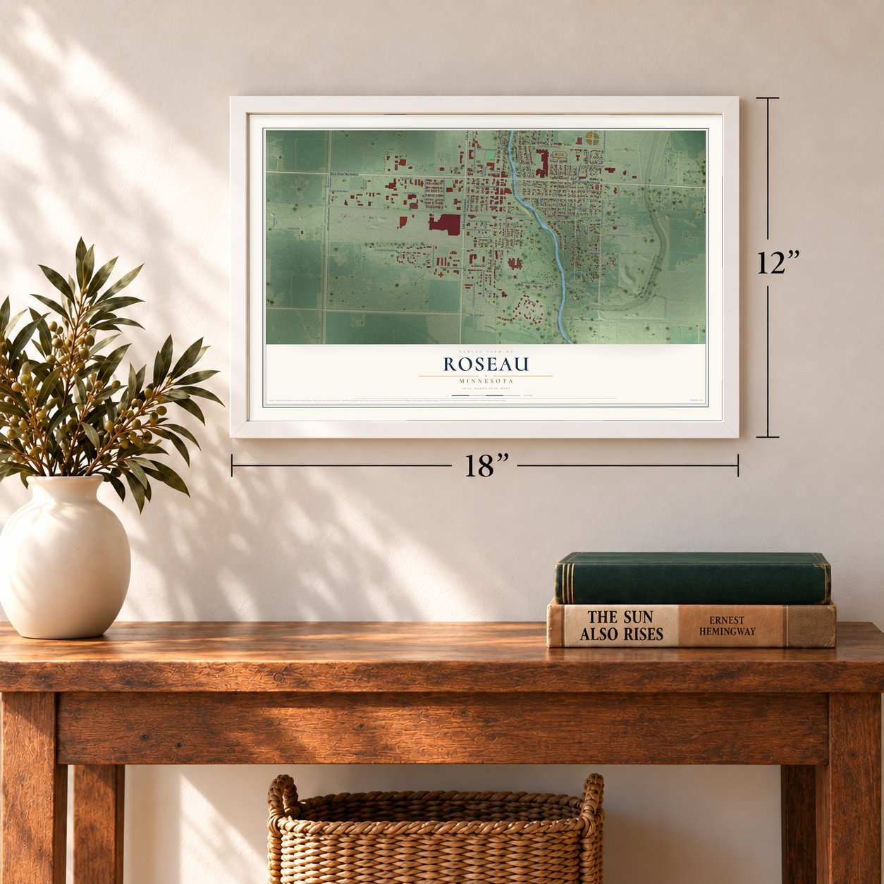 Roseau, Minnesota map, 12 x 18 inch print in a white frame in an entryway